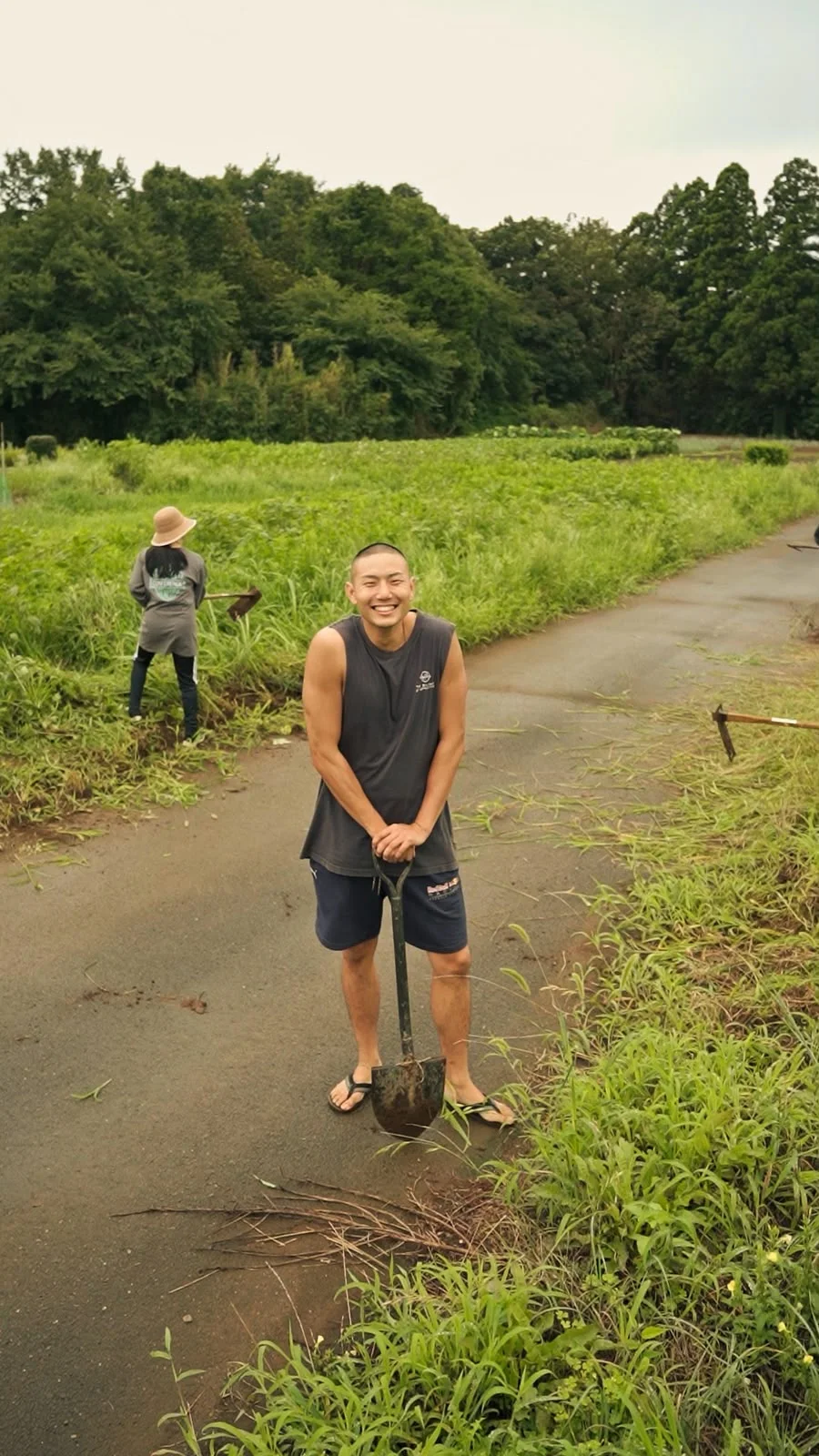 Yoshi with a spade beside the fields where Fukuwatari began