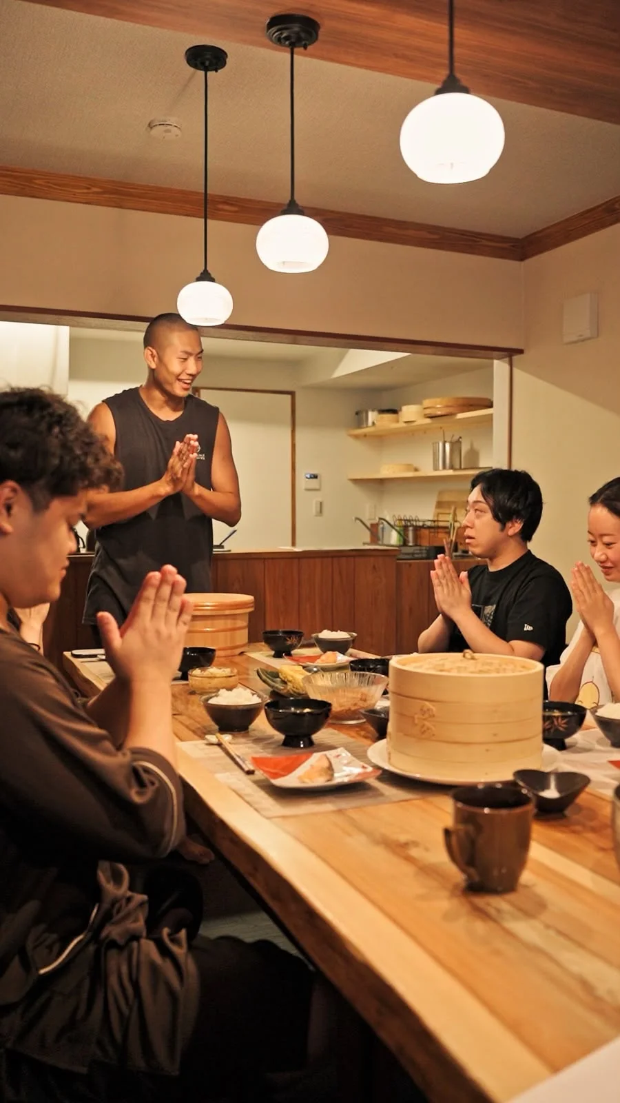 Yoshi and guests saying Itadakimasu together before a meal