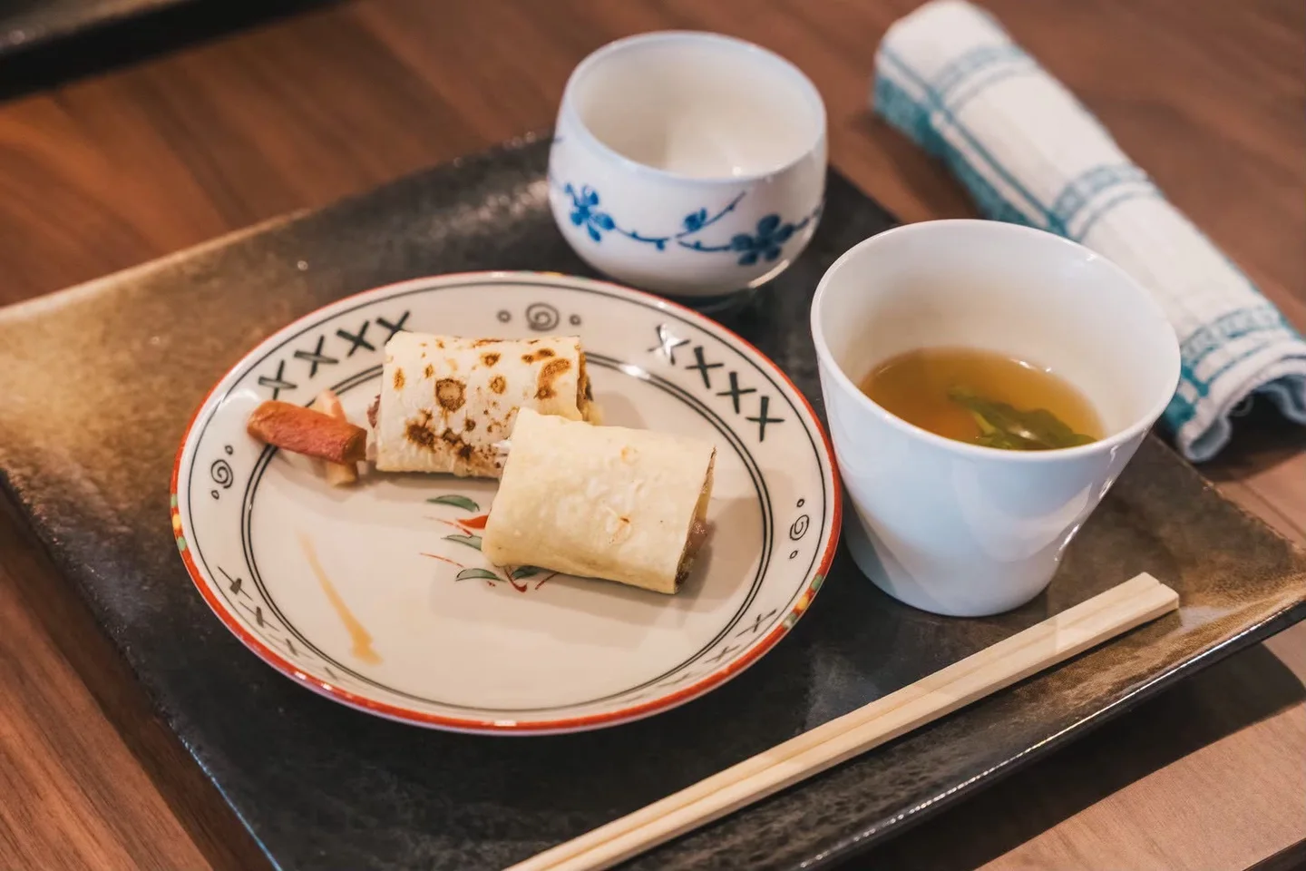 Tea and small Japanese dishes served together on a tray